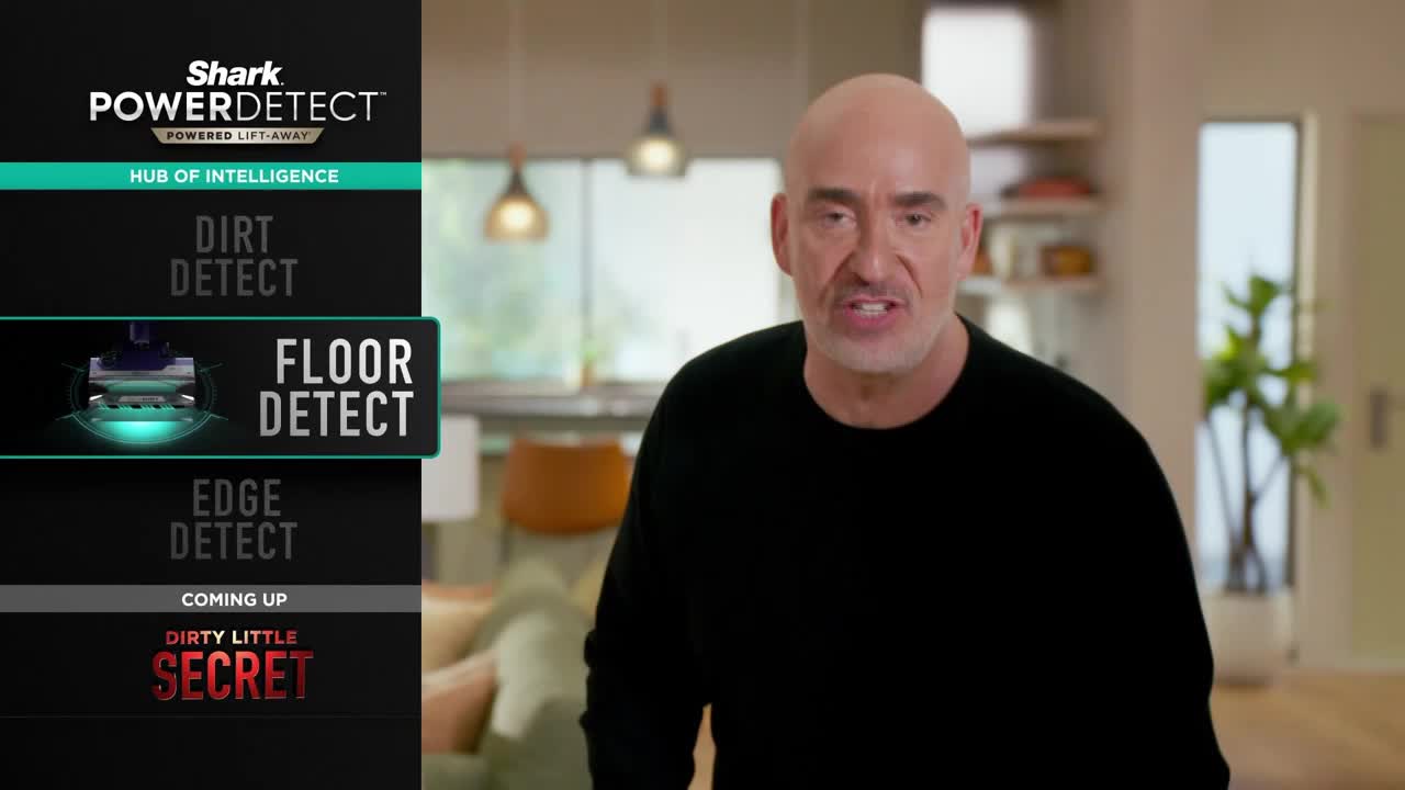 A man in a black shirt speaks directly to the camera, with a product graphic to his left. The graphic highlights "Floor Detect" on a vacuum cleaner advertisement, possibly on a United States television channel like Game Show Network.
