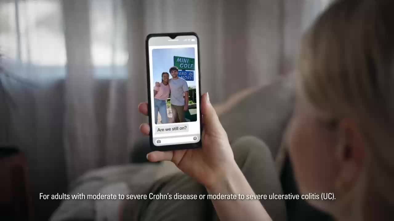 A young couple poses for a photo in front of a "Mini Golf" sign. Their text message asks, "Are we still on?"