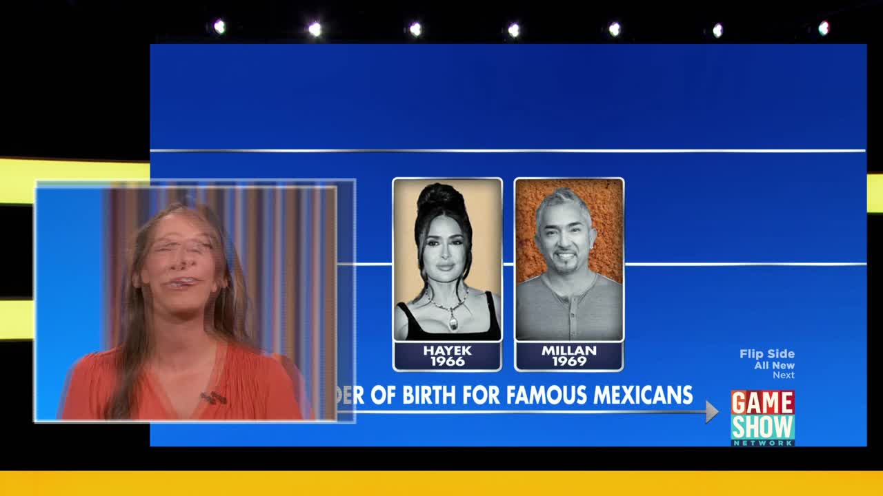 A woman on the Game Show Network makes a funny face as two portraits, Salma Hayek and Cesar Millan, appear on screen. The text below them reads "ORDER OF BIRTH FOR FAMOUS MEXICANS."