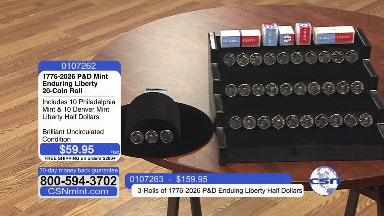 Rows of silver half dollars gleam on a black display stand, each coin showing a profile. Small boxes, labeled "Enduring Liberty," sit atop the stand, hinting at the history of these U.S. coins.