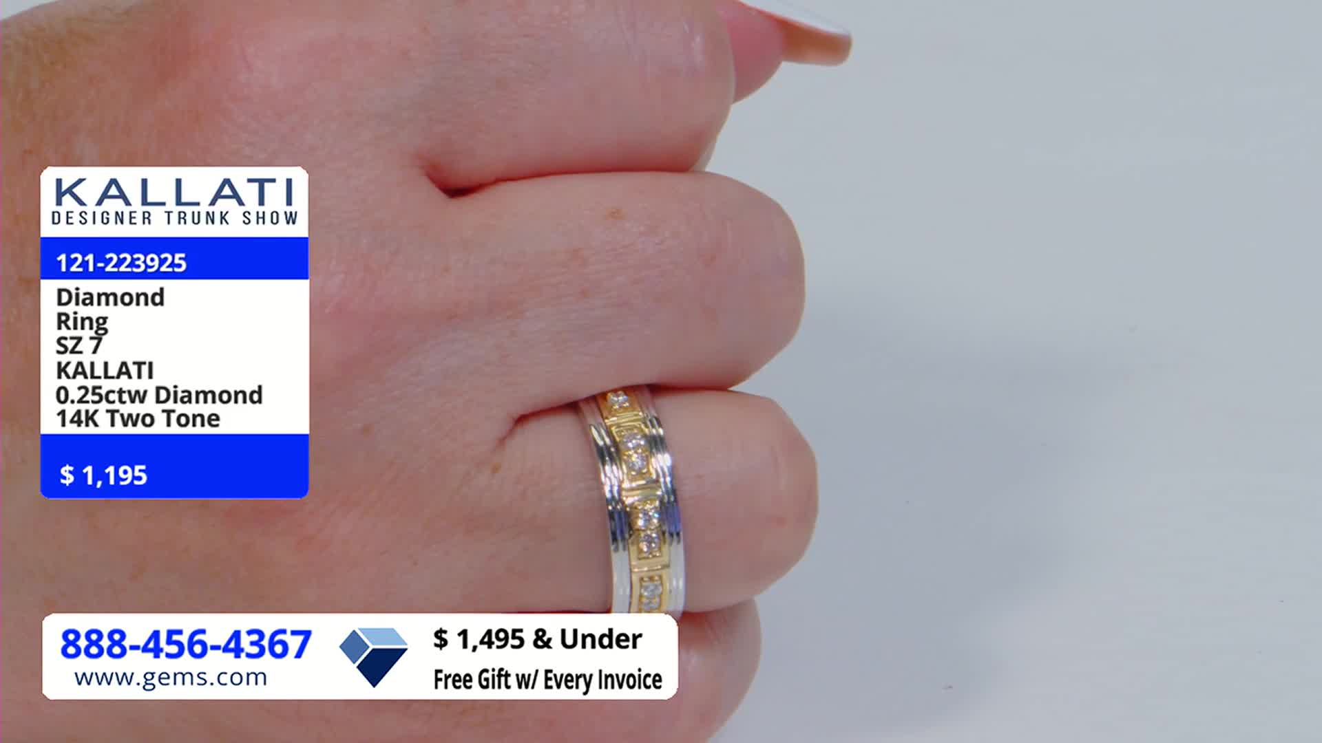 A hand, with a ring on its finger, is held up against a white background. The ring, which is two-toned, is being presented on the Gem Shopping Network in the United States.
