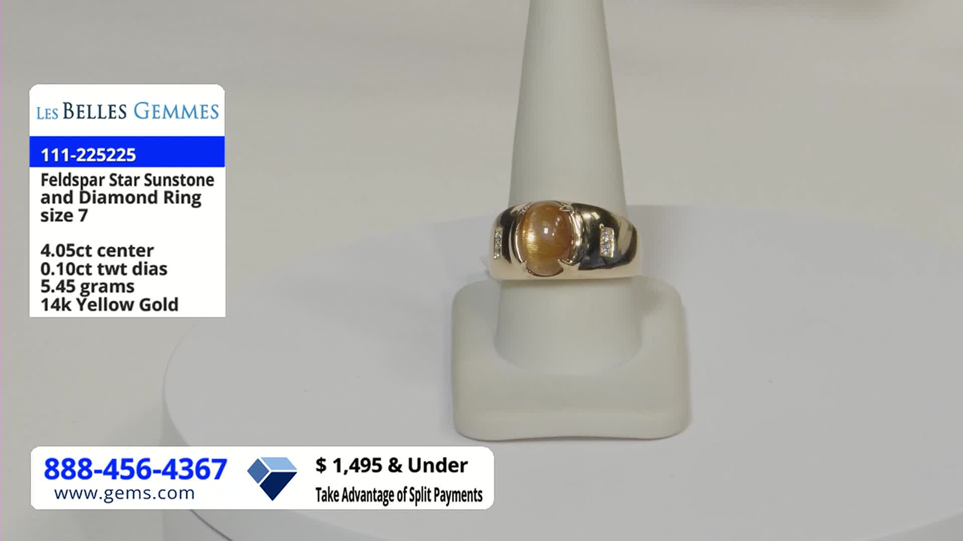 A gold ring with a large, orange gemstone sits centered on a display stand. Information about the ring, including the price, is displayed on the screen, likely as part of a Gem Shopping Network presentation.
