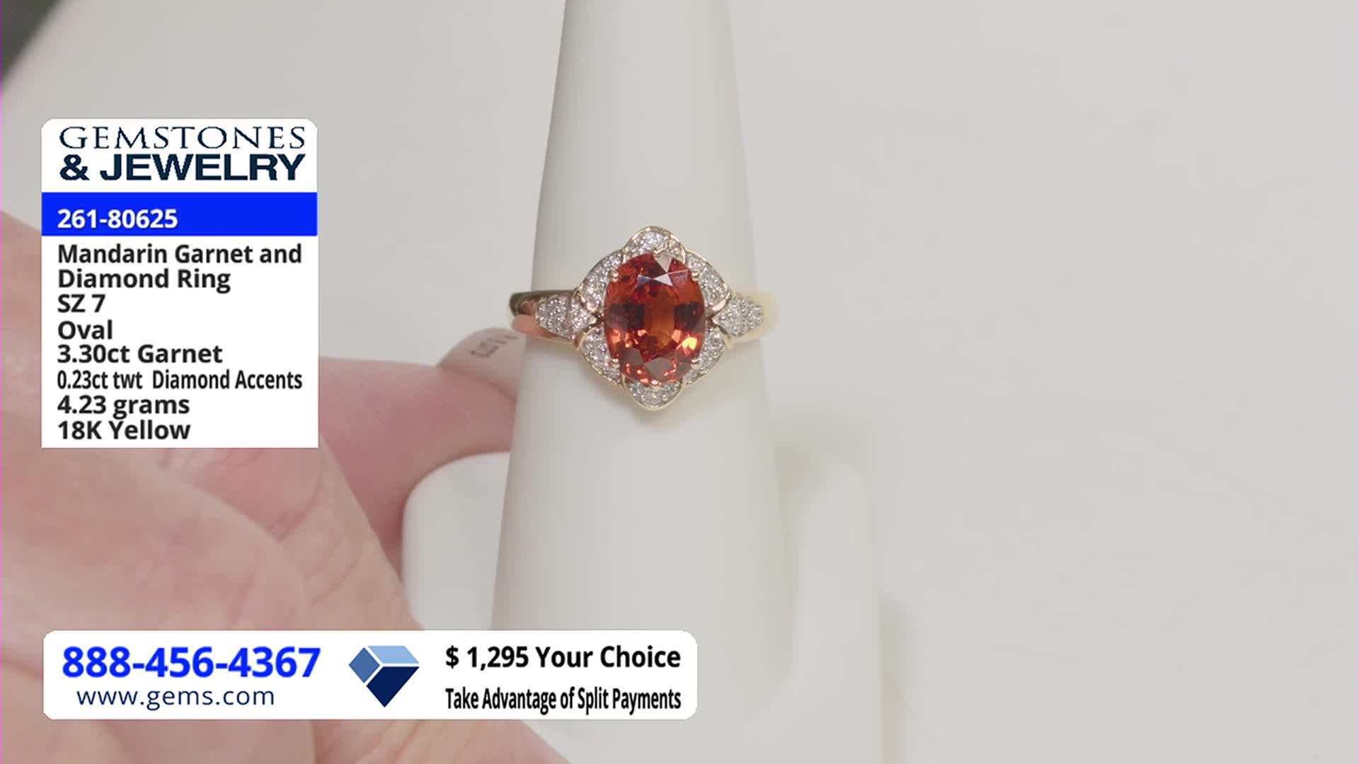 A ring with a large orange gemstone sits on a white display. The Gem Shopping Network logo and price information are visible in the corner.
