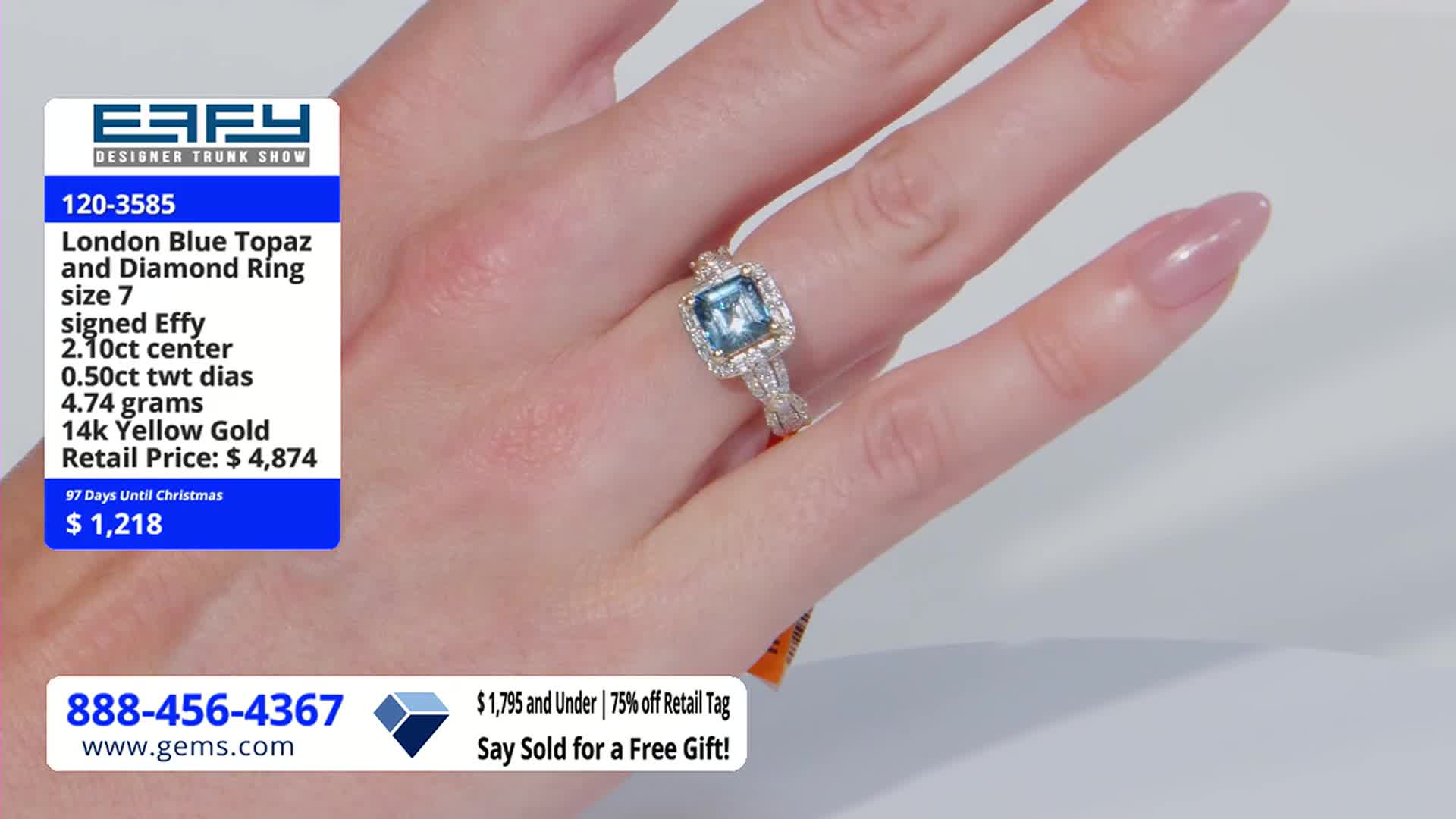 A hand, with long, polished nails, displays a ring with a large, square, blue gemstone. The Gem Shopping Network logo and price information are visible in the corner.
