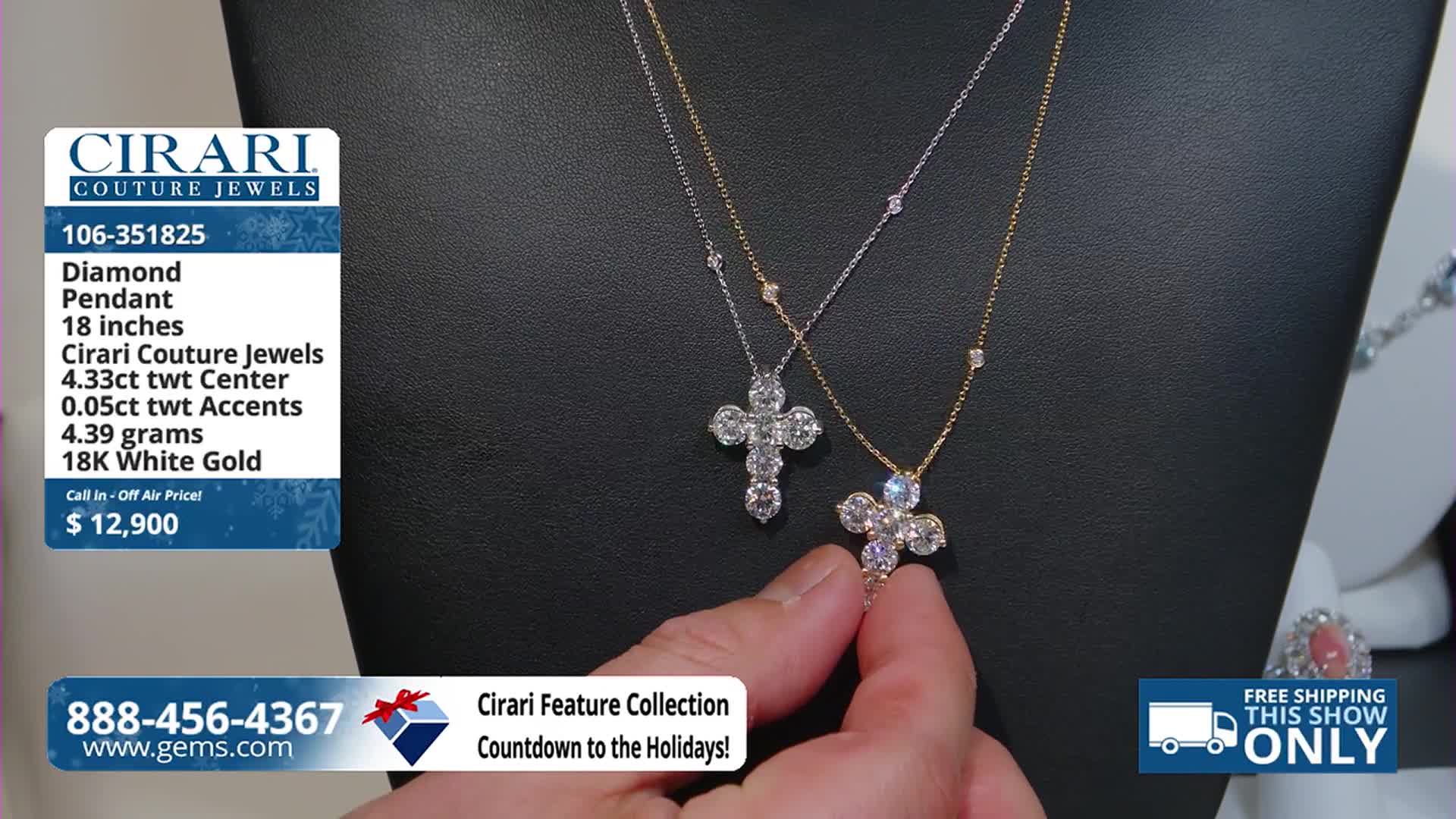 A hand gently holds a diamond-encrusted cross pendant, showcasing its sparkle against a black background. The Gem Shopping Network is advertising the necklace, with a price tag of $12,900.
