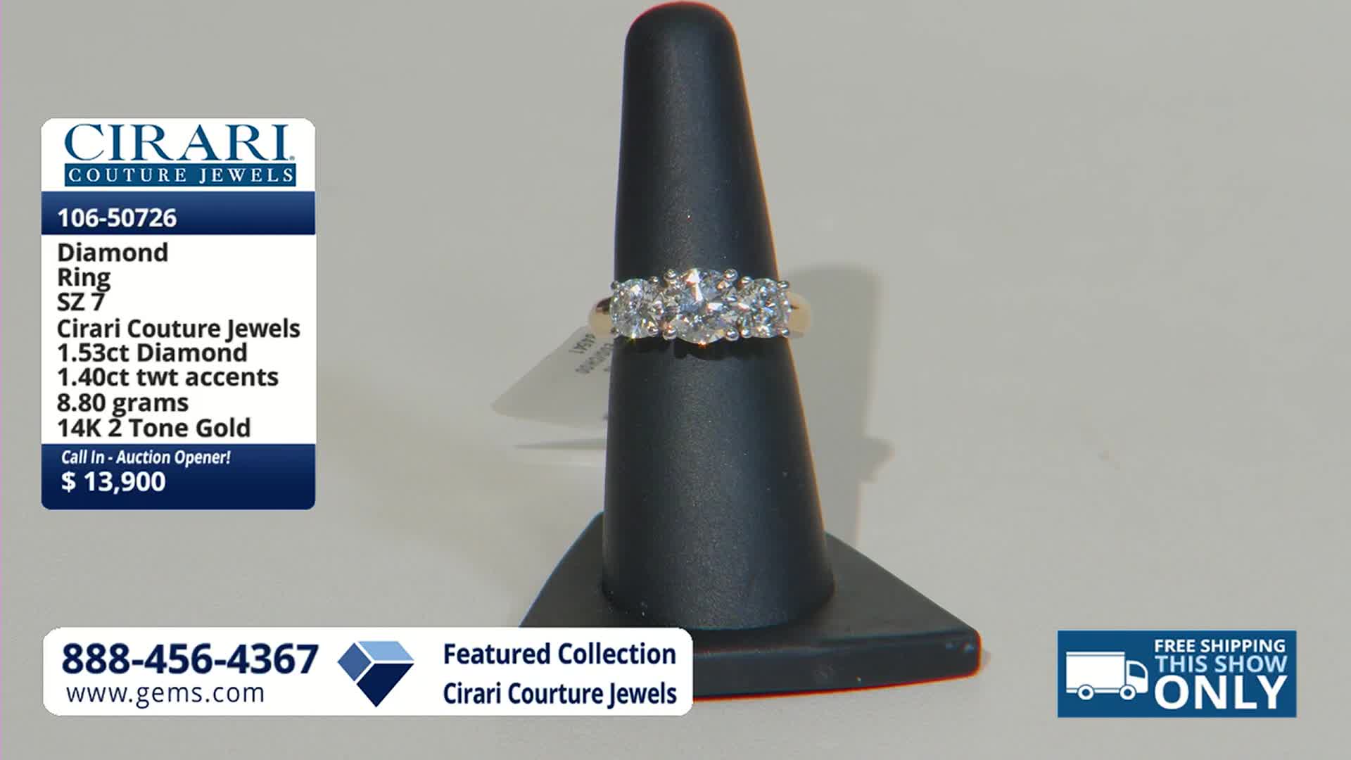 A three-stone diamond ring rests on a black display stand. The ring, featuring 1.53 carats of diamond and 14K two-tone gold, is being presented on the Gem Shopping Network.
