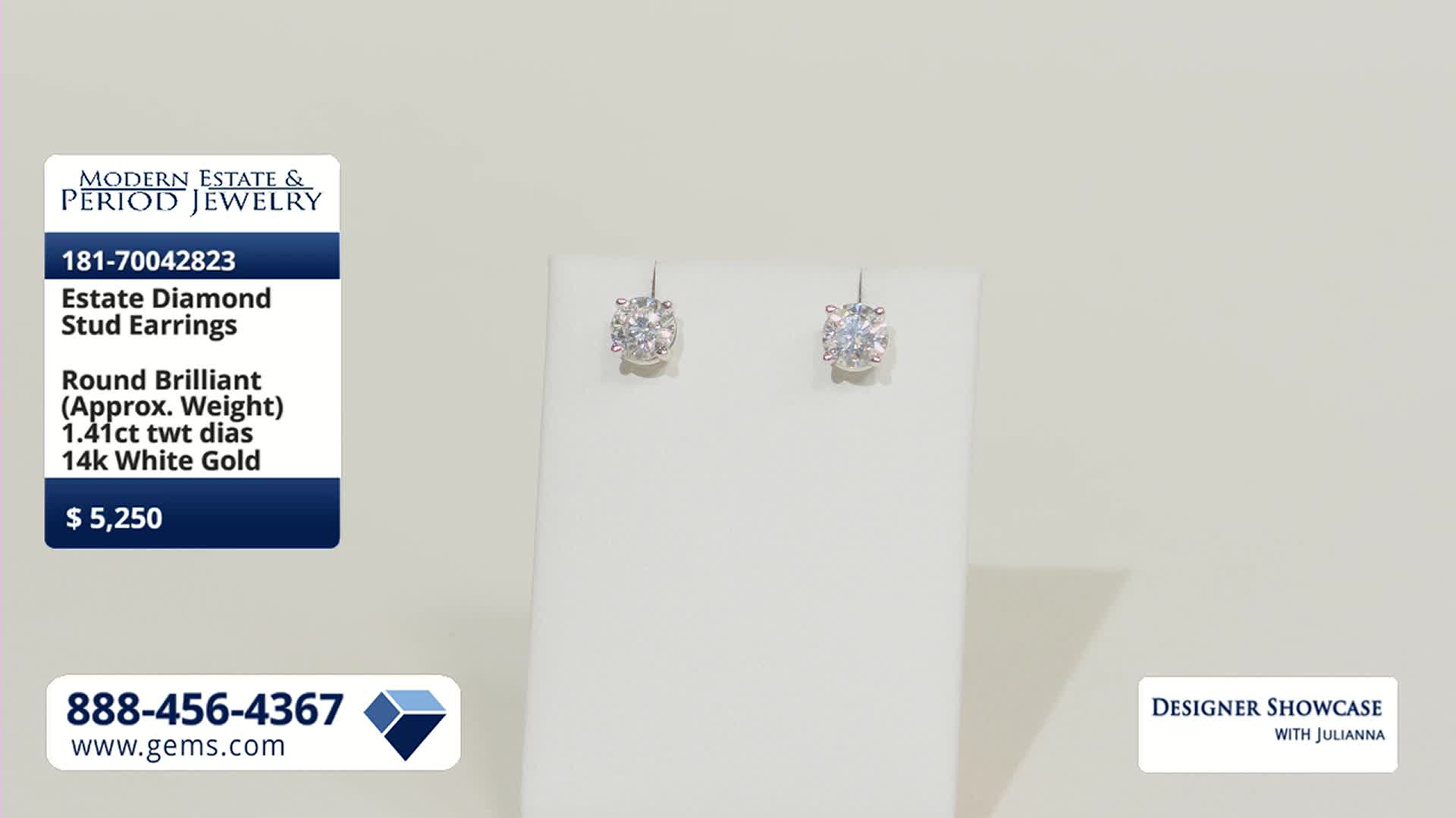 A pair of diamond stud earrings, each featuring a round brilliant cut stone, rests on a white display. The Gem Shopping Network's branding and pricing information are visible on the left.