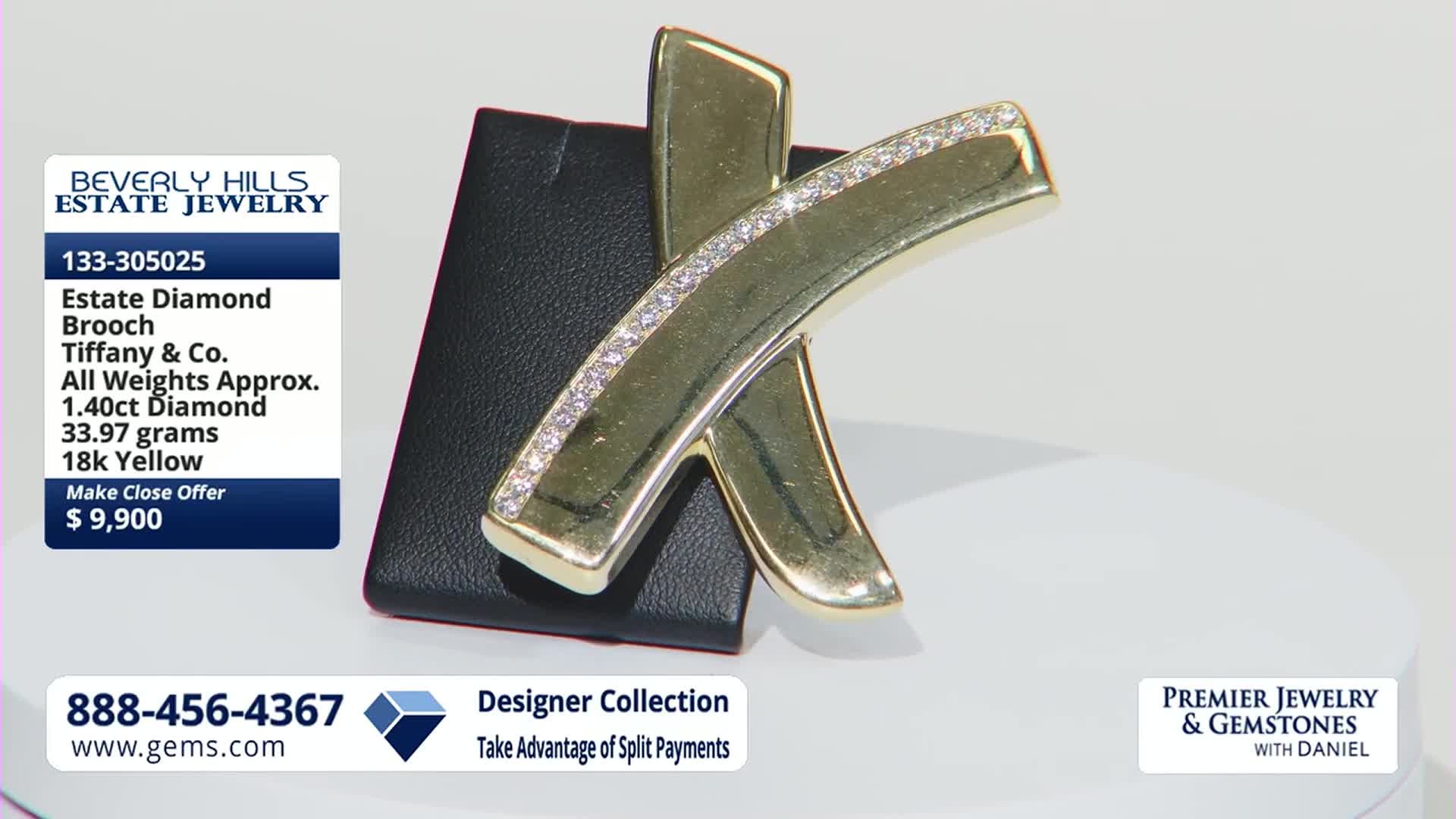 A gold brooch, set with diamonds, rests on a black display. The Gem Shopping Network logo and contact information are visible.