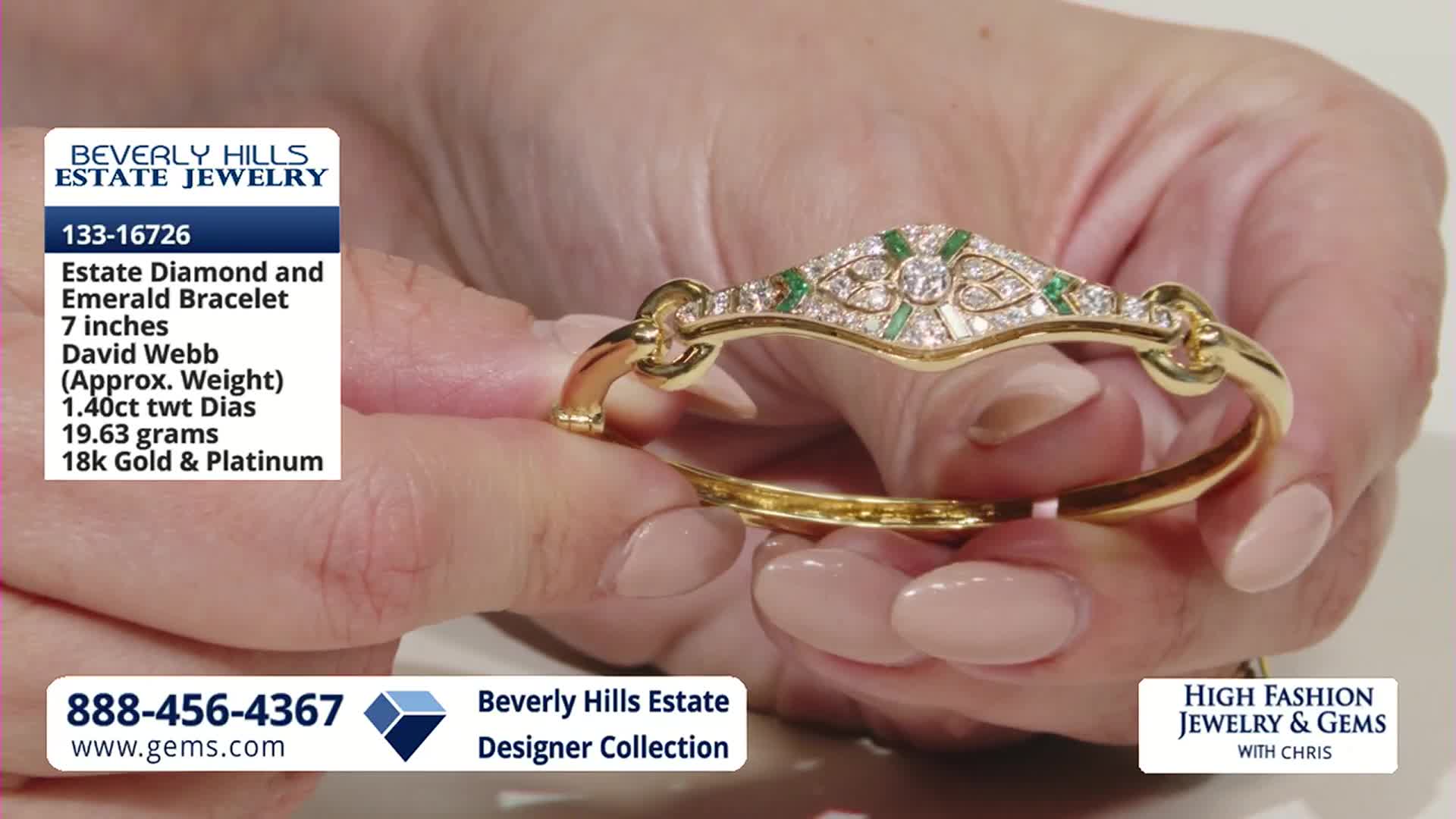 A delicate gold bracelet, studded with diamonds and emeralds, is being presented. The piece, a David Webb design, is being held open by a person's hands.