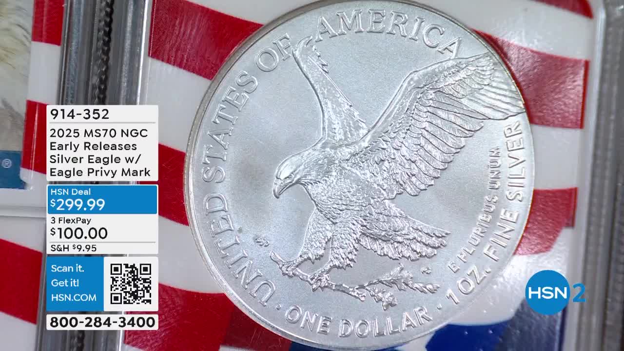 A gleaming silver coin, depicting an eagle, is displayed against a red, white, and blue backdrop. The price and details for the "Silver Eagle" are listed on a small graphic in the corner, and the HSN2 logo is visible.
