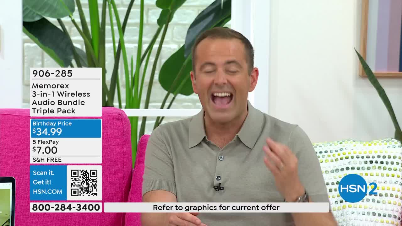 The man on the screen is laughing, gesturing with his right hand. He's sitting on a bright pink couch, and a product description is displayed to his left.
