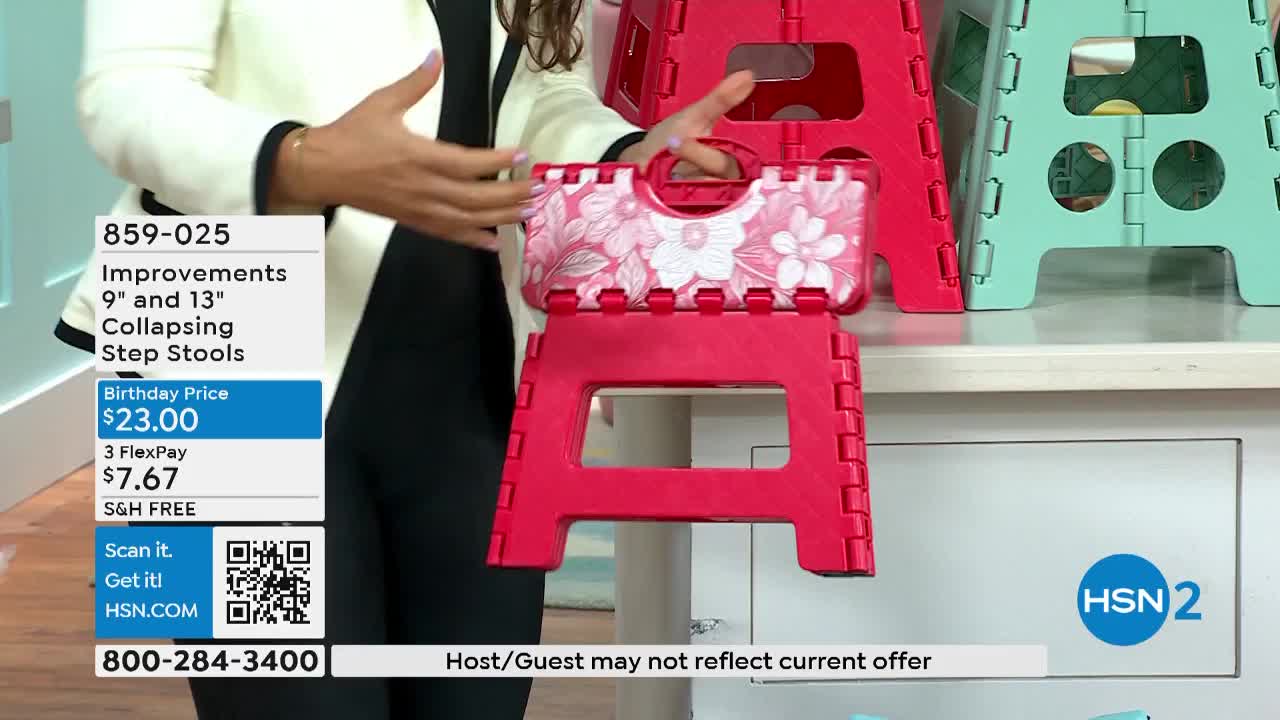 A woman on HSN2 holds up a folded step stool with a floral design while demonstrating its features. Other step stools in bright colors sit behind her on a shelf.
