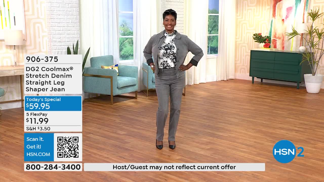 A woman in a gray pantsuit stands in a studio, smiling and looking directly at the camera. The HSN2 logo is visible, and a graphic displays the price of the jeans she's wearing.
