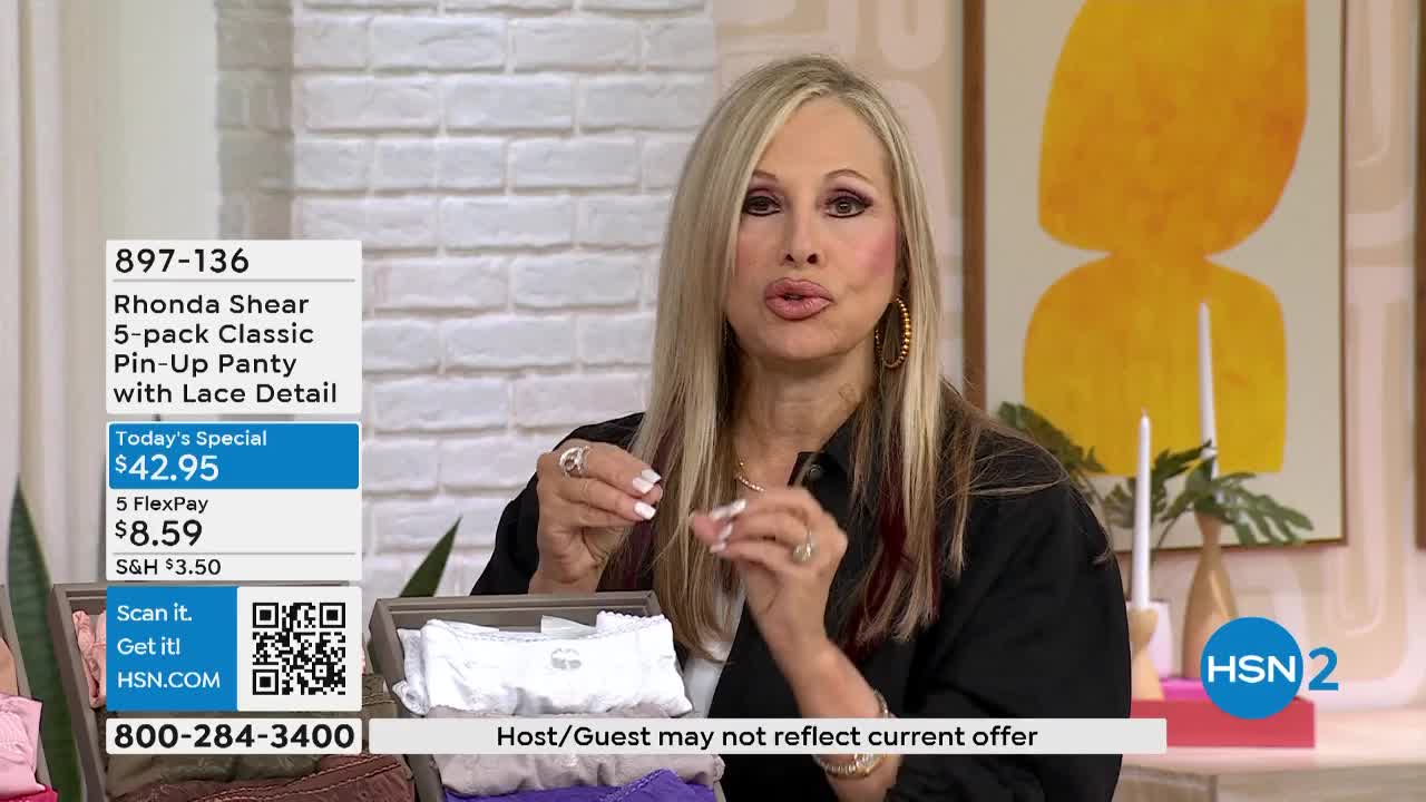 A woman on HSN2 gestures with her hands, holding up a white lace-trimmed panty from a box. The on-screen graphics advertise the item as a "Rhonda Shear 5-pack Classic Pin-Up Panty."

