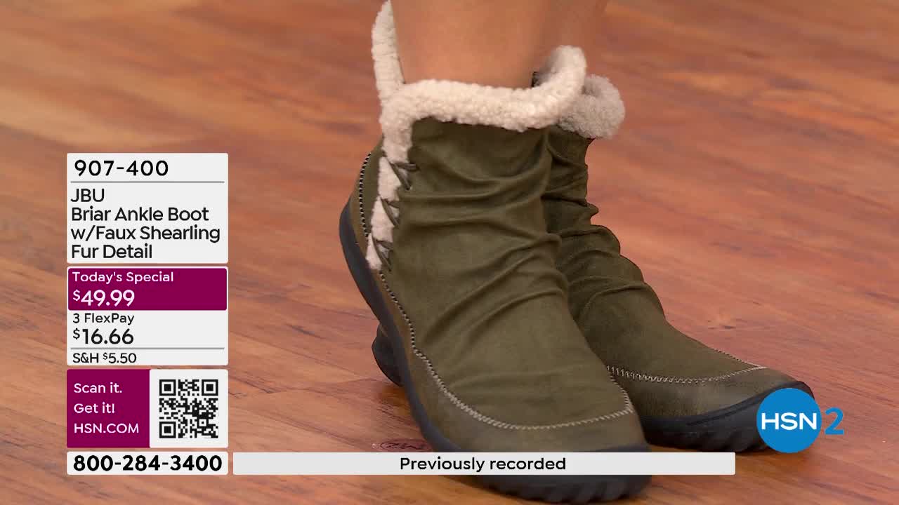A person is wearing olive green ankle boots with faux shearling trim. The boots are being showcased on HSN2, with a price tag of $49.99 for the "Today's Special."
