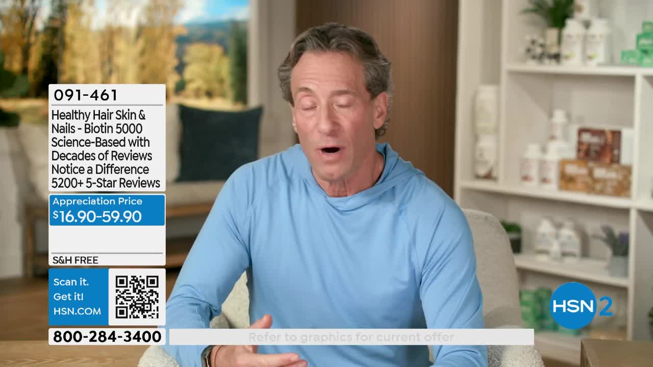 A man in a light blue long-sleeved shirt speaks animatedly, his hands gesturing. Behind him, a graphic displays product information and pricing for "Healthy Hair Skin & Nails."