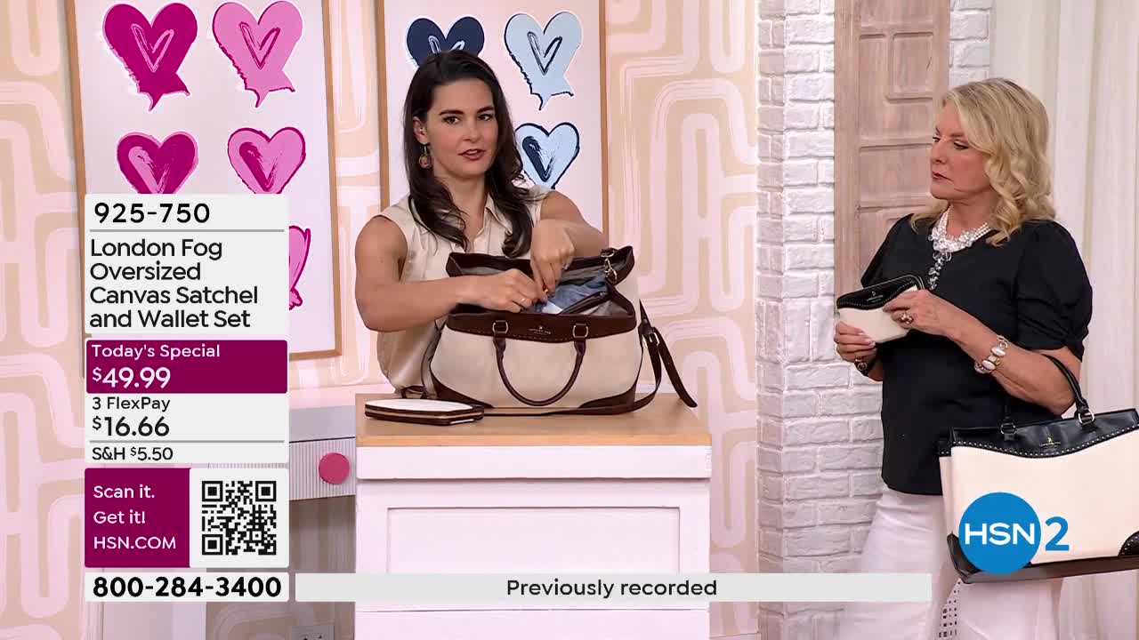 A woman is showing off a tan and brown London Fog satchel, pulling items from its open top. Another woman stands nearby, holding a matching wallet.