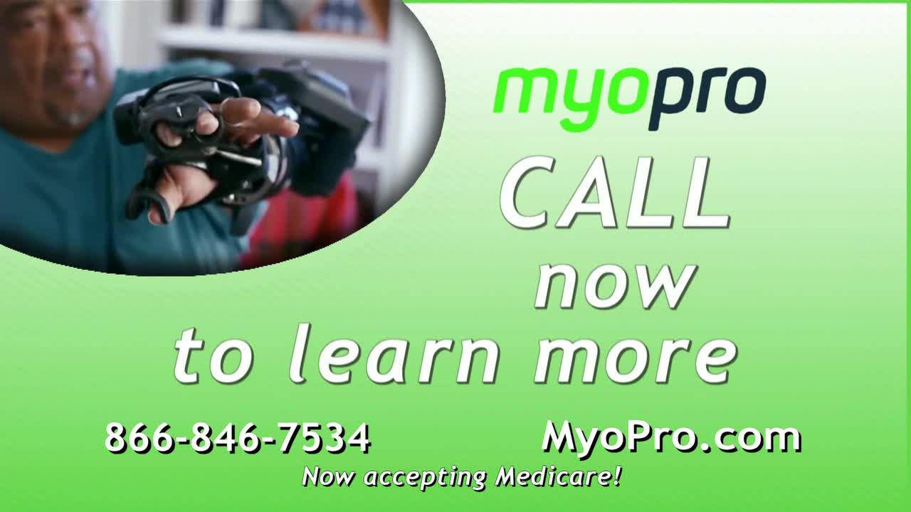 A man extends his hand, the fingers encased in a black device. The advertisement on ION Plus encourages viewers to call to learn more about the product.
