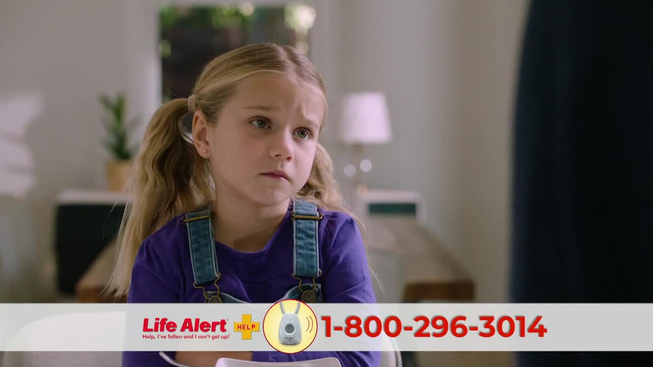A young girl in overalls looks concerned, her gaze directed off-screen. A Life Alert ad is displayed at the bottom of the screen.
