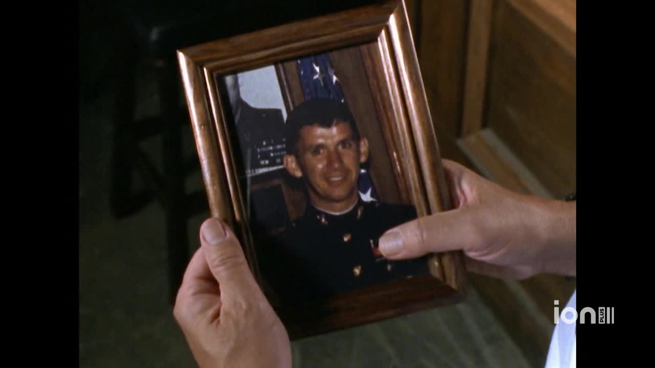 A man's hands hold a framed photograph of a smiling soldier in uniform. The ION Plus logo is visible in the corner.
