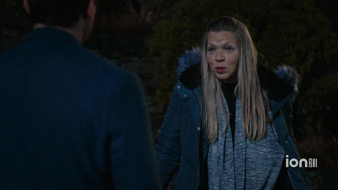 A woman in a teal jacket is speaking to someone off-camera, her expression earnest. The ION Plus logo is visible in the corner, suggesting this is a scene from a television show.
