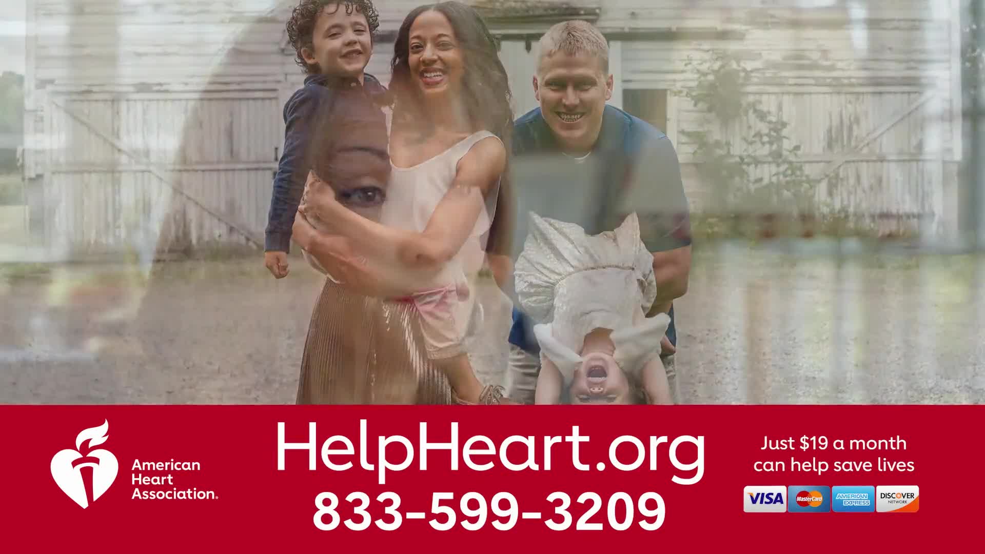 A smiling family is outside, the parents holding their children playfully. The ad on Jewish Life Television for the American Heart Association is promoting their services.
