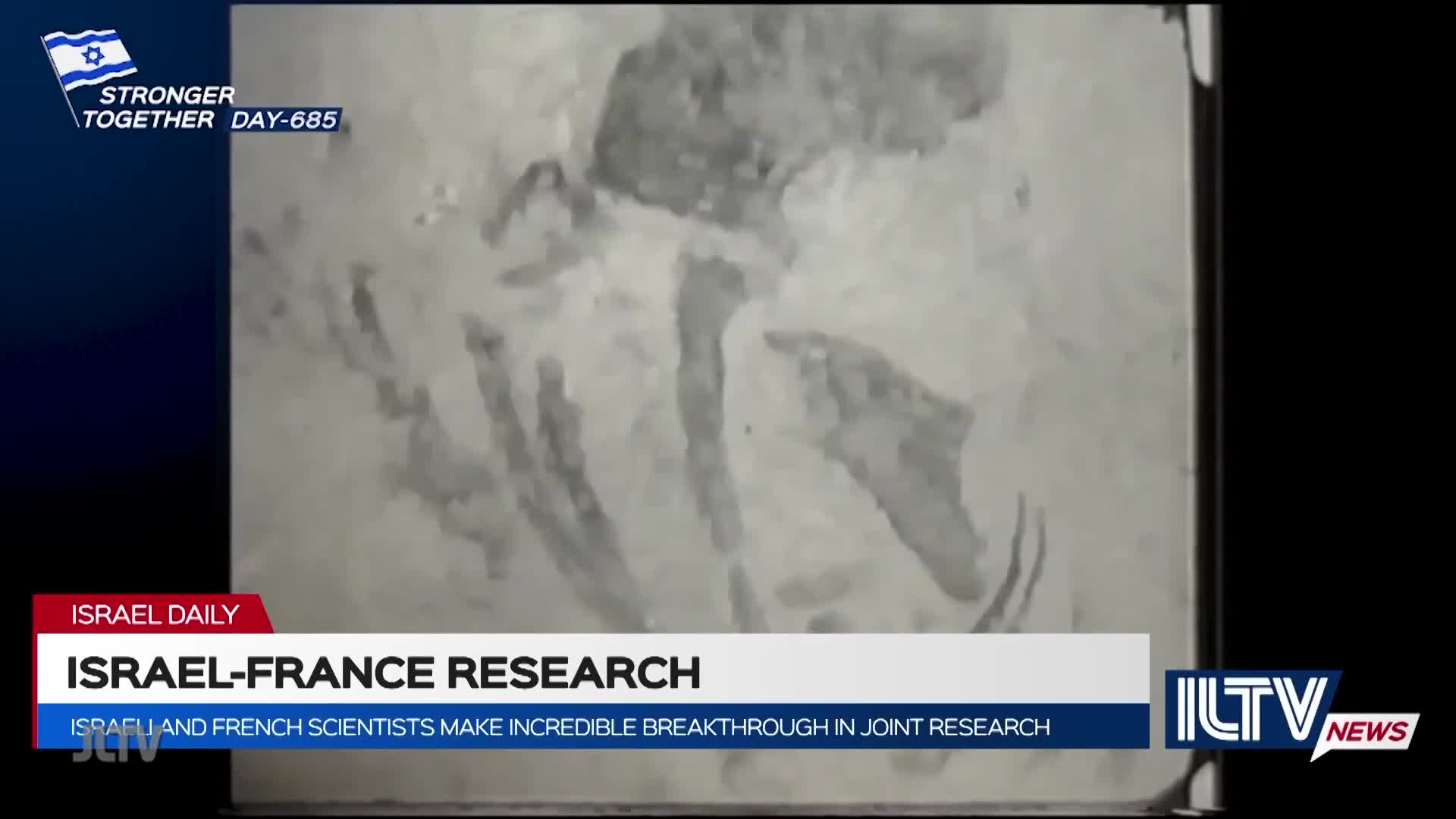 On Jewish Life Television, a grainy, black-and-white image fills the screen. The segment from ILTV News reports on Israel-France research, with text highlighting a scientific breakthrough.
