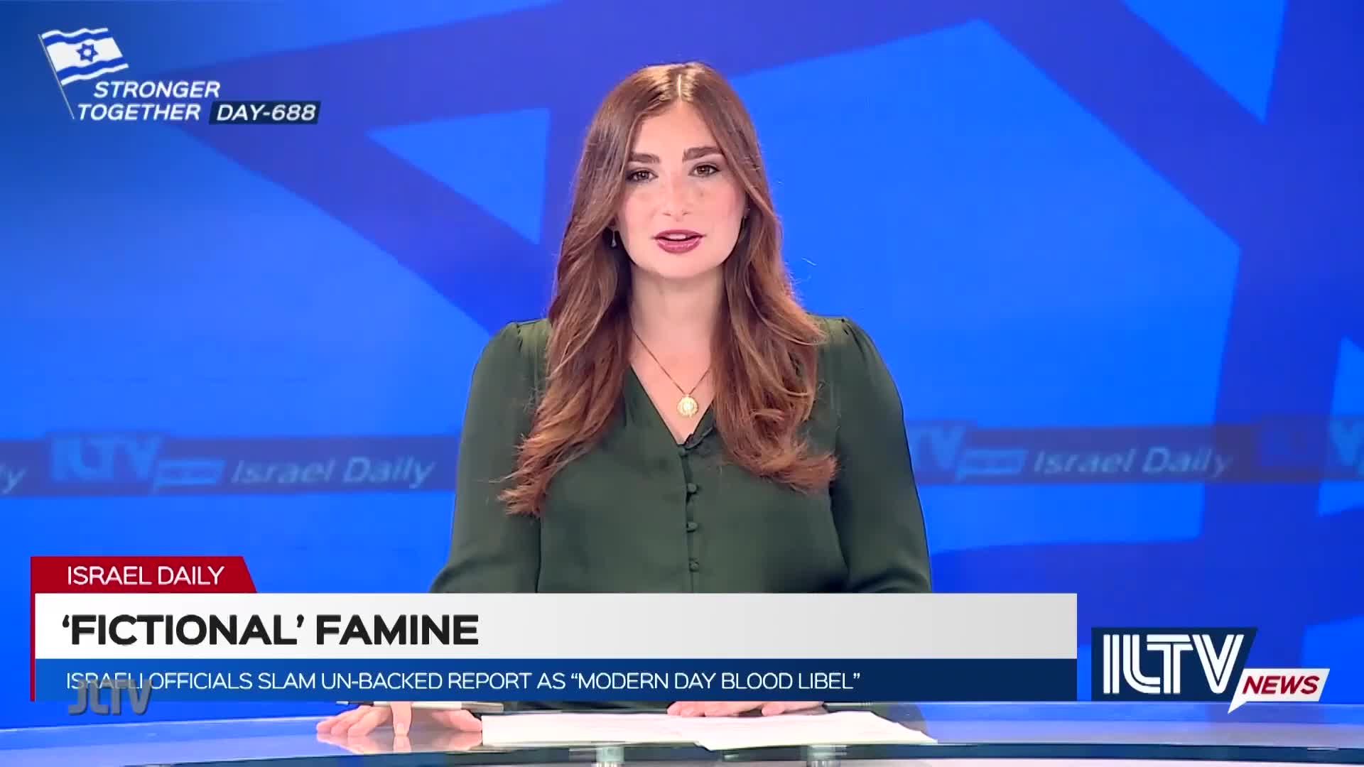 A woman with auburn hair and a green blouse is speaking directly to the camera. The ILTV News graphic displays the headline, "'FICTIONAL' FAMINE."
