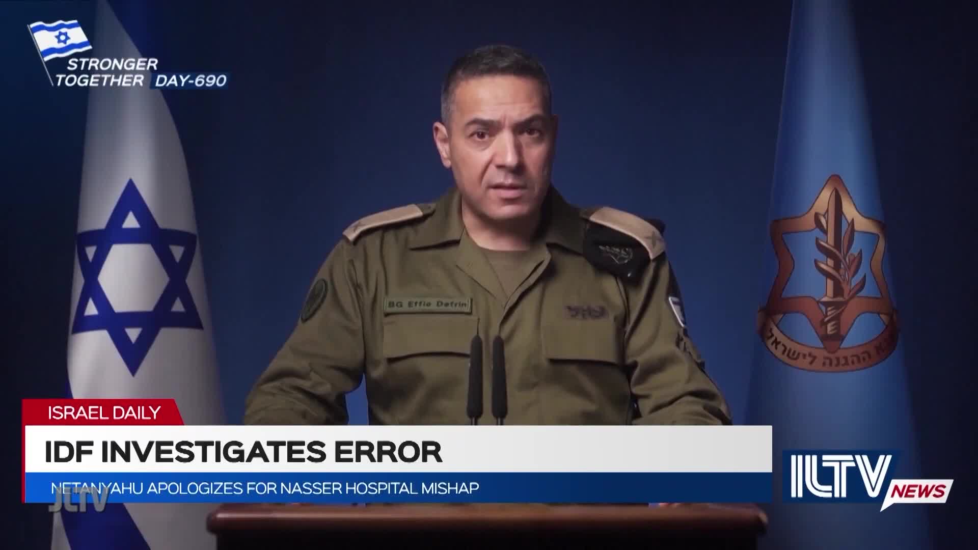 A man in a military uniform speaks into two microphones, framed by Israeli flags and the ILTV News logo. The chyron below announces an IDF investigation on Jewish Life Television.
