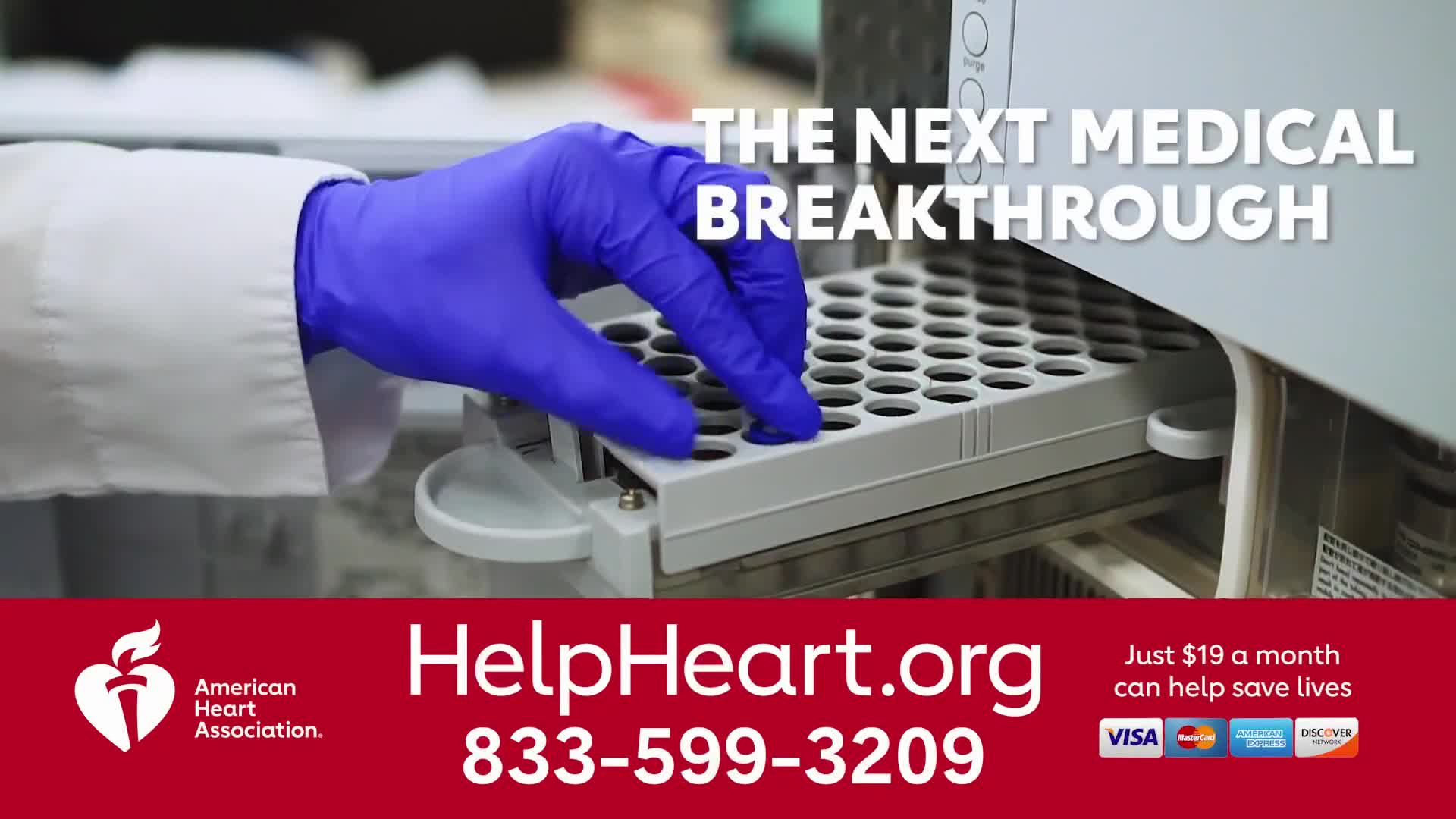 A gloved hand in a white lab coat carefully places a vial into a tray. The image, part of an American Heart Association ad, flashes on Jewish Life Television.
