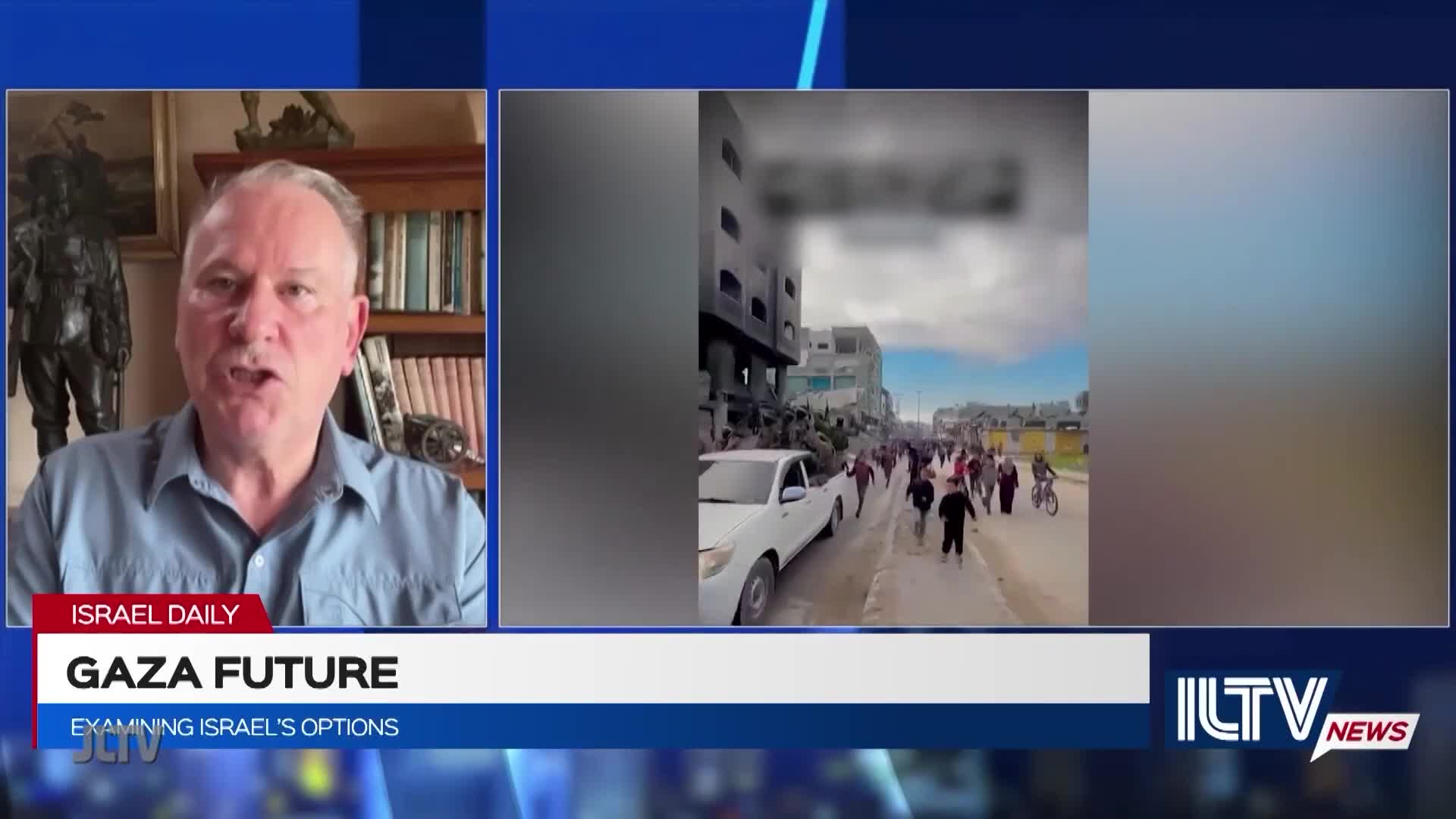 A man on Jewish Life Television discusses "Gaza Future" as footage plays on screen. A crowd of people walks down a street, and a white pickup truck is parked nearby.
