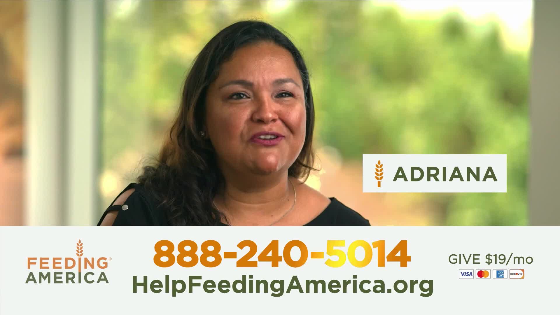 Adriana speaks directly to the camera, her face framed by dark hair. Below her, the Feeding America logo and a phone number are displayed, inviting donations.