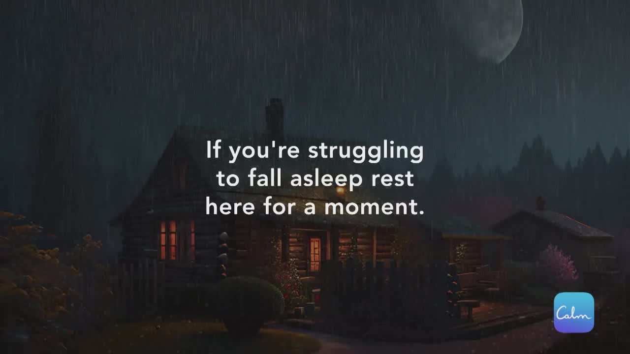 Rain falls steadily over a cozy cabin, its windows glowing warmly against the dark, moonlit sky. The scene is designed to be calming, suggesting a peaceful escape.
