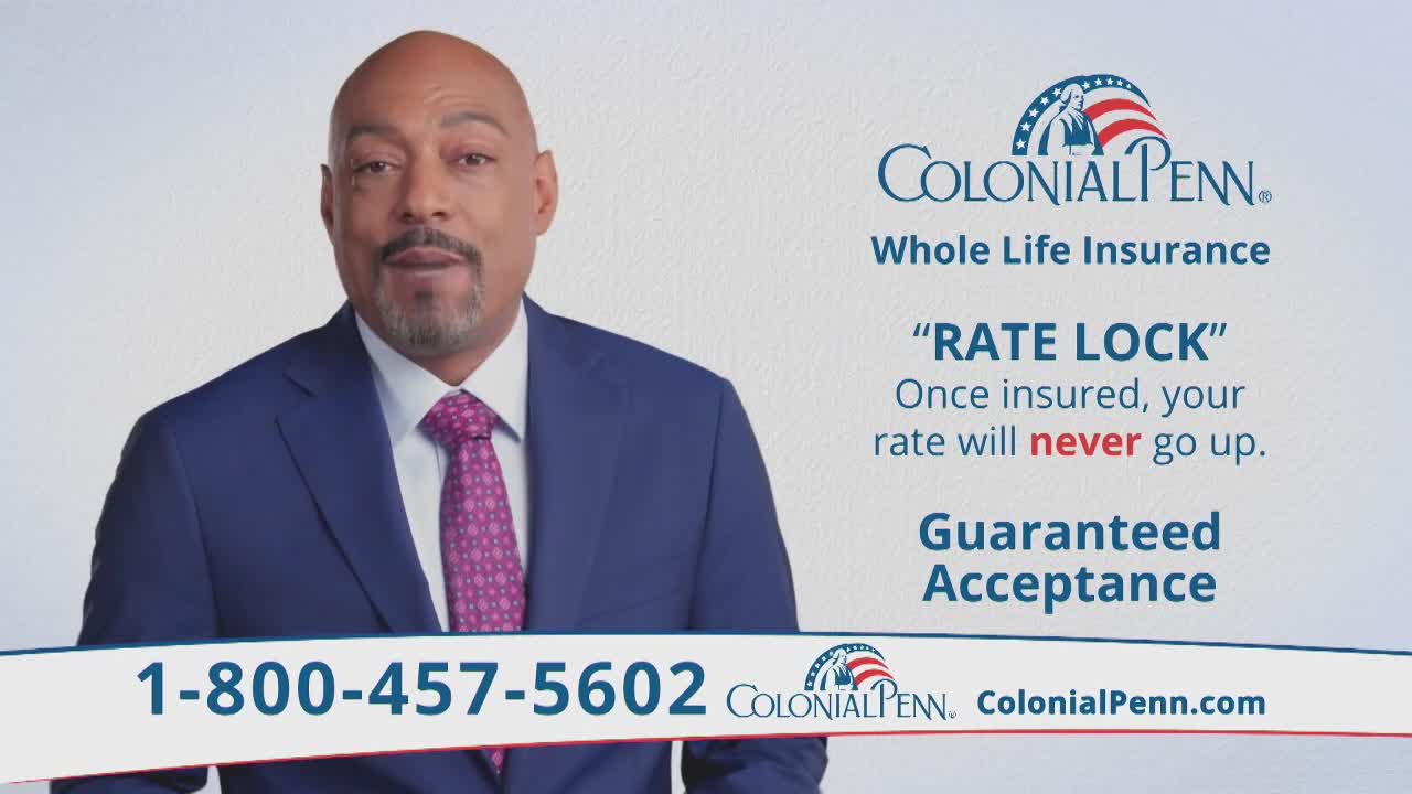 A man in a blue suit and a pink tie is speaking directly to the camera, likely in a commercial. Above him, the Colonial Penn logo and insurance details are displayed on a white background.
