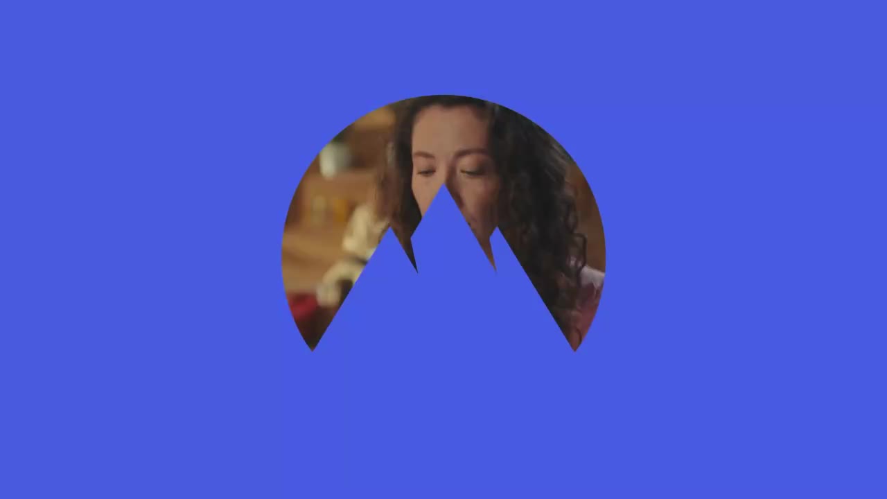 A woman with curly hair is visible, framed by a blue mountain-shaped cutout. Her eyes are closed, and she appears to be in a room with warm lighting.
