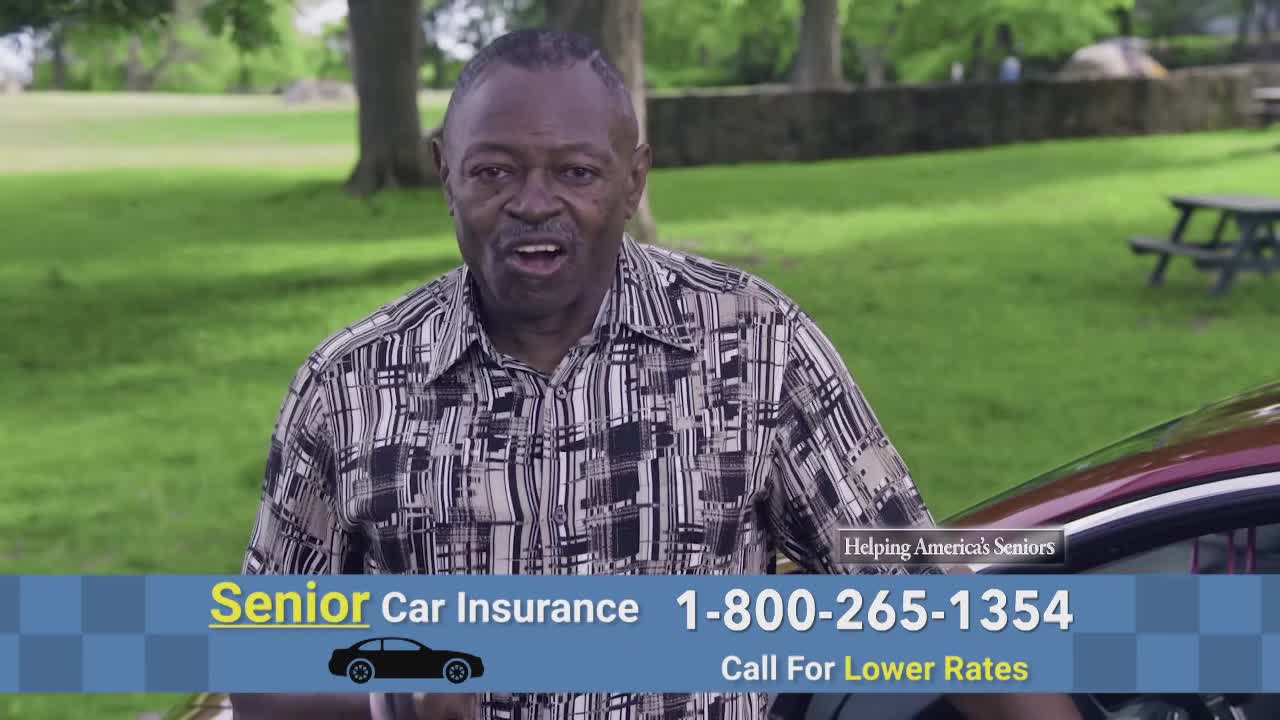 A man in a patterned shirt stands next to a car, speaking directly at the camera. The screen displays a phone number for senior car insurance, a common topic in the United States.
