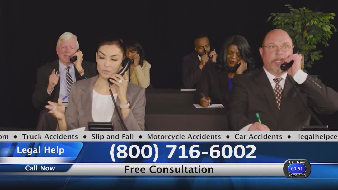 A group of people in suits are all on the phone, seemingly taking calls. The bottom of the screen advertises legal help with a phone number.
