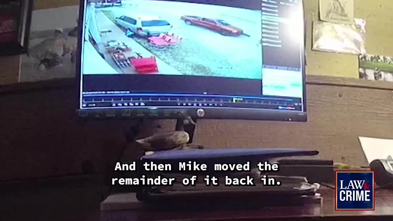 A security camera feed shows a car parked outside, and a text overlay says "And then Mike moved the remainder of it back in." The Law & Crime logo is in the corner.
