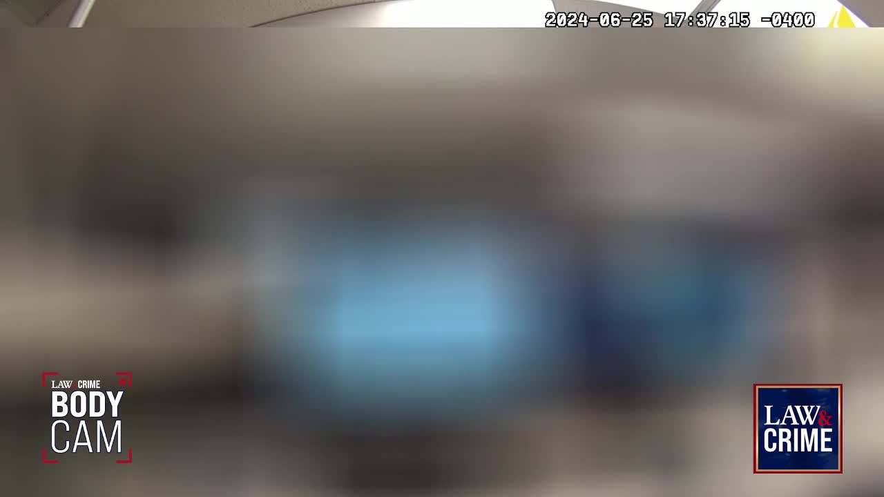 A bright blue light emanates from a rectangular object in the distance. The "Law & Crime BODY CAM" logo appears in the lower left corner.