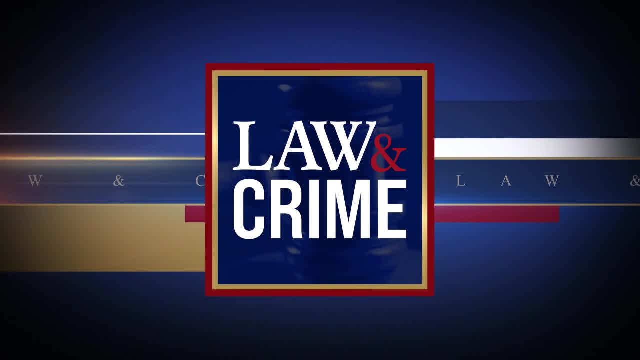 The "Law & Crime" logo, with its bold white text and red ampersand, stands out against a dark blue background. Faintly visible behind the logo is the silhouette of a gavel, a symbol of justice.