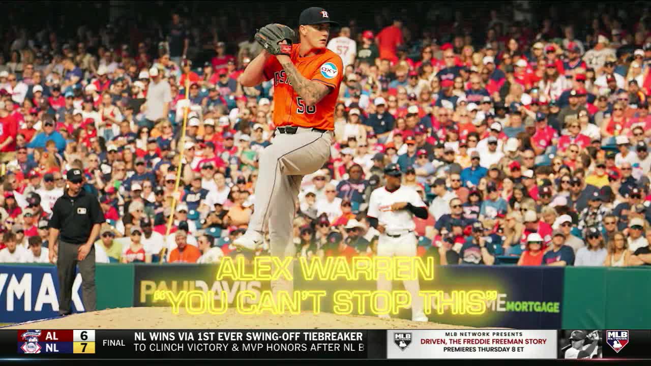 The pitcher, wearing number 50, is mid-windup, his right leg extended. The catcher and umpire are focused on the play, while the crowd in the stands looks on.
