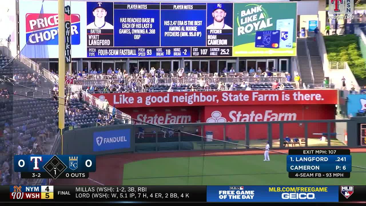 The batter, Wyatt Langford, is up at the plate, while the pitcher, Noah Cameron, is on the mound. The scoreboard shows the score tied at zero, with one out in the bottom of the first inning.
