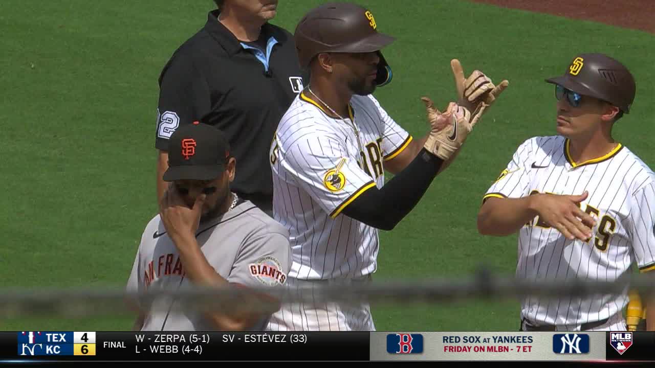 A Padres player gestures with his fingers, while another looks on, and a Giants player appears dejected in the background. The MLB Network graphic at the bottom shows a Red Sox vs. Yankees game is coming up.
