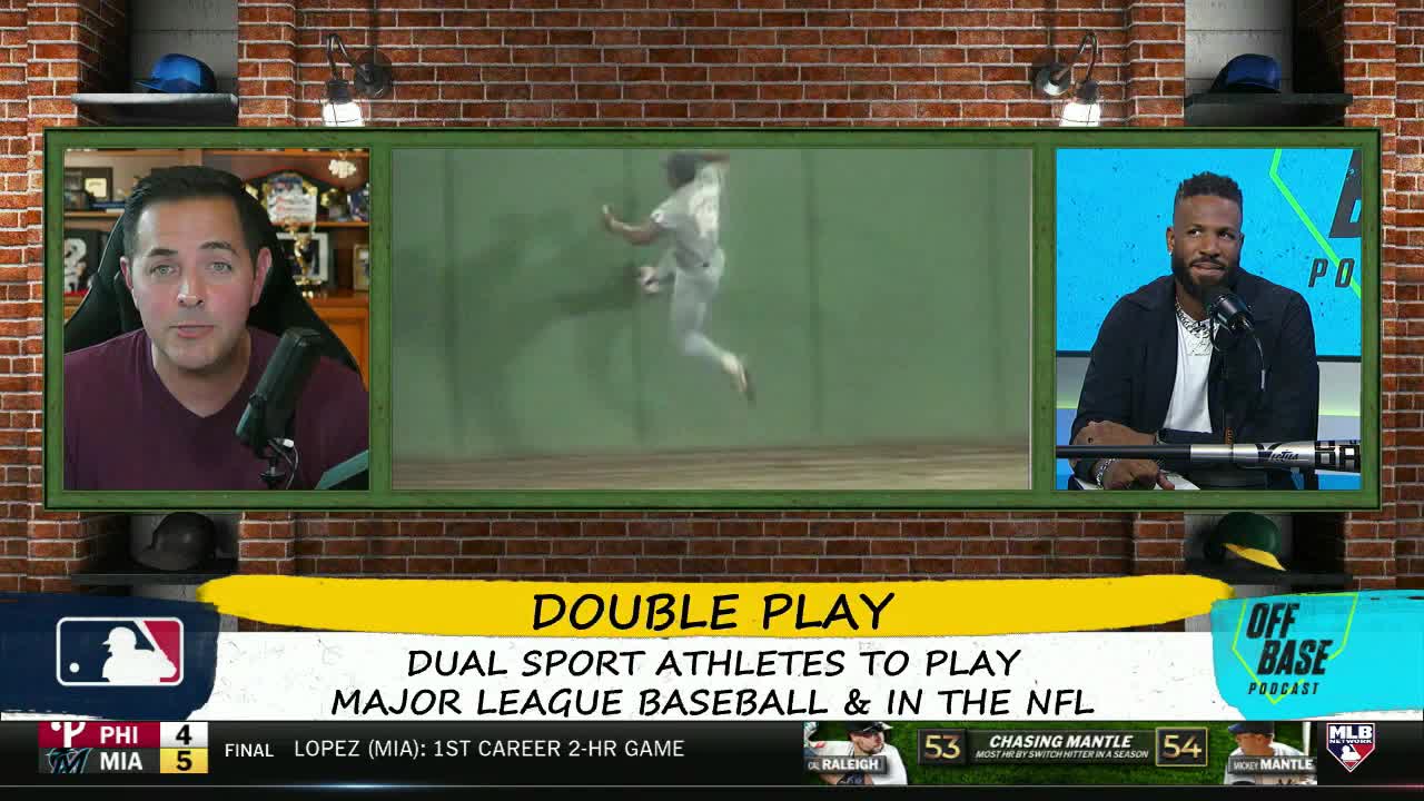 On MLB Network, a replay shows a baseball player leaping, arm outstretched, seemingly about to make a catch. The broadcast is discussing dual-sport athletes, featuring a game between the Phillies and Marlins.
