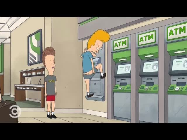 One of the guys is climbing on an ATM, while the other one stands and watches. The scene is from an episode of *Beavis and Butt-Head* on MTV Classic.
