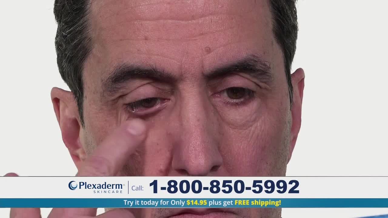 A man is touching the skin under his eye with his finger.  A phone number and product name are displayed at the bottom of the screen.
