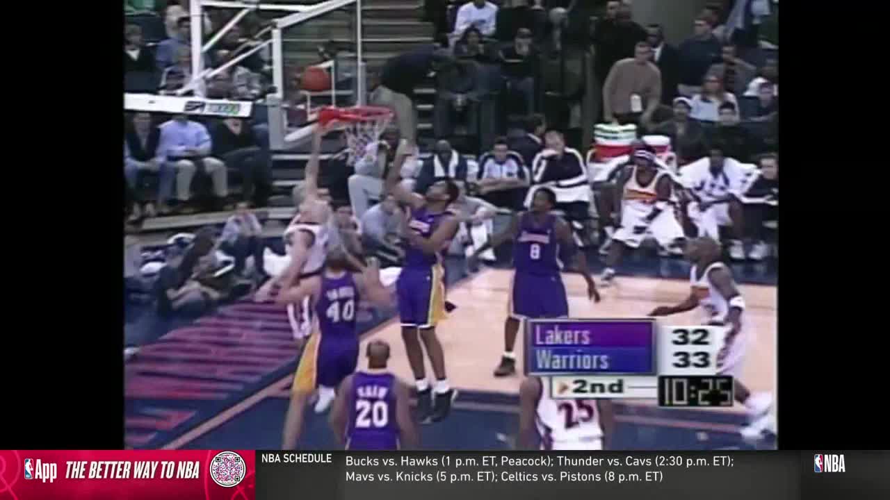 A Lakers player leaps toward the basket, ball in hand, as a Warriors player jumps to defend. The score is close, and the second quarter is winding down on NBA TV.
