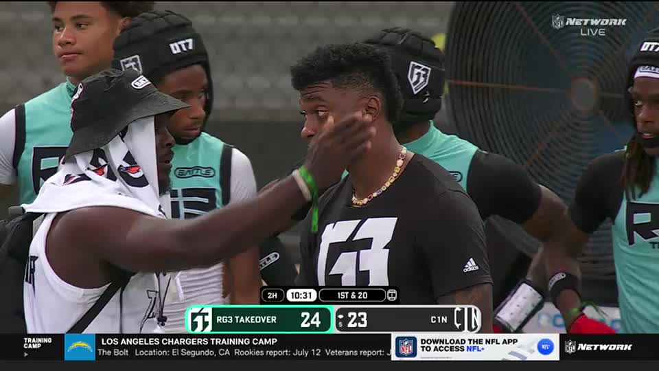 A man in a bucket hat and towel is patting the cheek of a player wearing a black shirt. The NFL Network logo is visible, and the score shows a close game.

