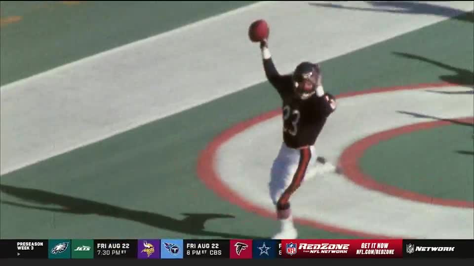 A Chicago Bears player, number 23, leaps in the end zone, ball raised high. He's celebrating a score, as the NFL Network's RedZone feed shows.
