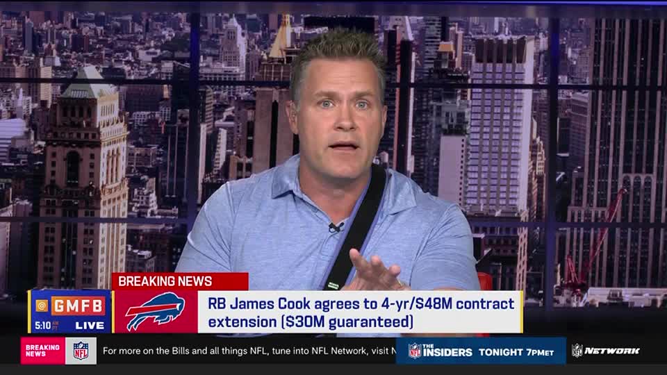 A man in a blue shirt gestures with his hands, speaking intently on the NFL Network's "Good Morning Football." Below him, a graphic announces a contract extension for Buffalo Bills running back James Cook.
